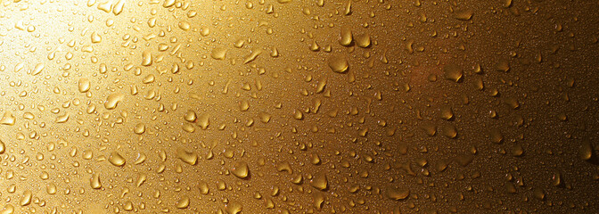 yellow water drops on glass