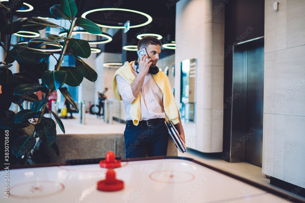 Poster smart casual coworker using modern technology for making operator conversation via mobility applicat