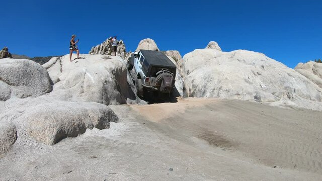 Jeep Wrangler Rubicon Offroad in the Nevada desert. Extreme 4x4 rock obstacle.