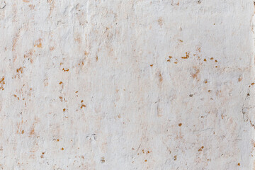 Shabby flat plaster wall with yellow streaks