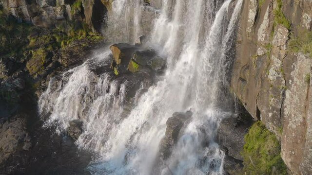 Mid range tripod clip of Ebor Falls waterfall after heavy rain fall