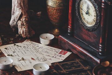 Close up of hand written letters. Old vintage worn postcards with writings in cursive wiccan witch...