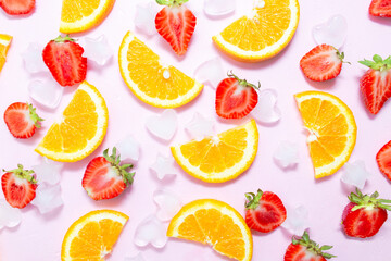 Fresh lemonade concept. Creative summer background. sweet strawberries and orange with ice on a bright pink paper background. Summer heat. vitamin drink, health and immunity care. top viev, flat lay.