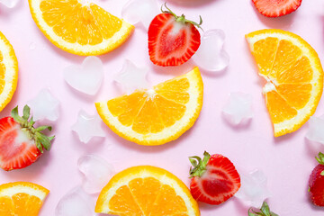 fruit salad concept. sweet strawberries and orange on bright pink paper background. Summer heat. vitamin drink, health and immunity care. detox tea or lemonade. Flatlay, copy spase
