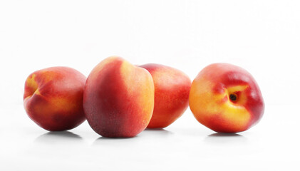 Fresh Nectarines. Group. White background. Side view