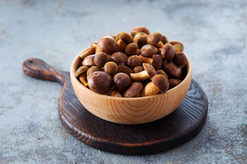 wooden bowl full of fresh mushrooms