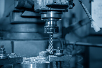 The NC milling machine milling  at the metal plate by flat endmill tools. The shop floor operation by NC milling machine.