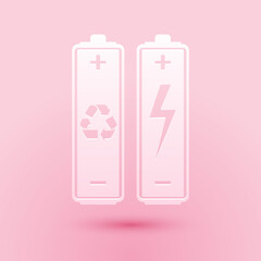 Paper cut Battery with recycle symbol - renewable energy concept icon isolated on pink background. Paper art style. Vector.