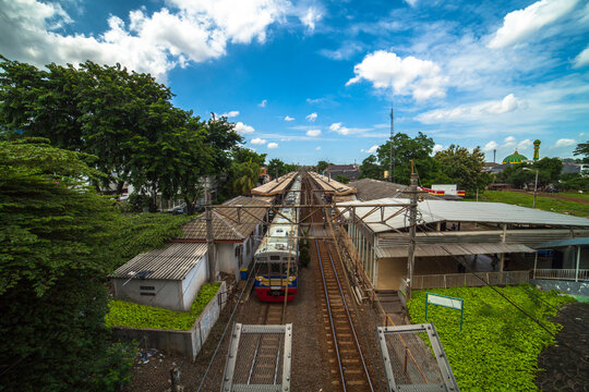 KRL Jakarta Commuter Train stop at the station 