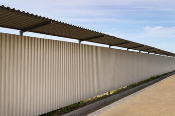 Metal profile sheet fence. Perimeter fencing of facilities under construction for safety....