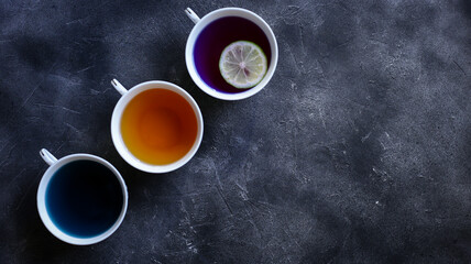 different types of tea on a dark background