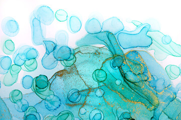 Transparent blue and gold watercolor drops on white background. Bubbles imitation.