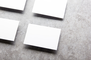 White business cards blank on textured background. Identity design, corporate templates, company style. Flat lay