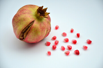 Ripe pomegranate fruit isolated on white background