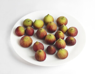Fresh fig fruit. Plate.  white background. Top view