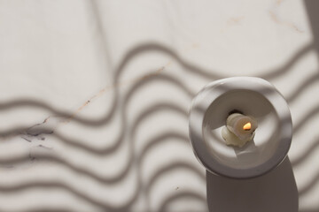 A Halloween candle is lit in the candlestick. Magic ritual on Halloween day, fortune-telling about...
