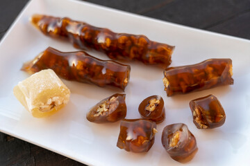 Cevizli sucuk made by dipping a string with walnuts into a grape molasses mixture. Churchkhela, Pestil, Cevizli Sucuk, Walnut sausage