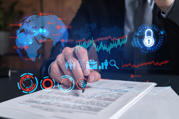 Businessman in suit signs contract. Double exposure with business icons hologram. Man signing...