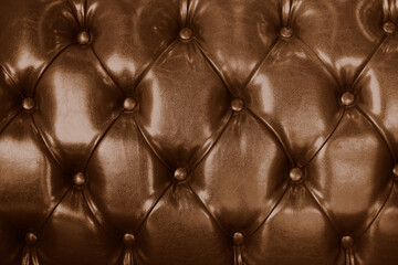 Fototapeta premium Sofa leather brown color vintage old texture furniture tile background.