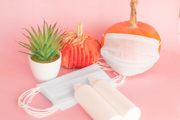 covid -19 autumn exacerbation of the virus. Orange pumpkin in a medical mask.