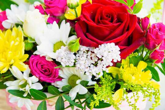 background from a bouquet of different flowers, different colors, the concept of birthday, wedding, date.