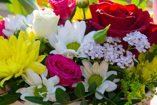background of a bouquet of different flowers, different colors, the concept of birthday, wedding, date.
