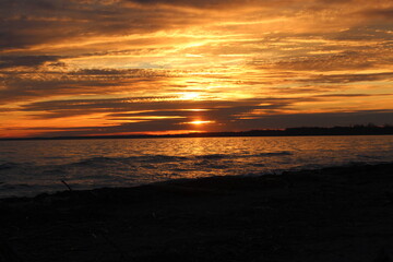 Fototapeta na wymiar Sunset Sunrise Over Beach Water