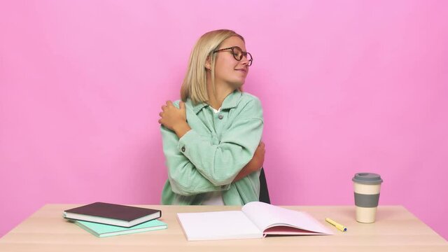 Young blonde caucasian woman hugs, smiling carefree and happy