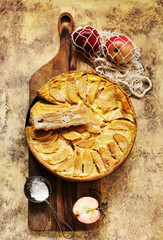 Apple pie on a wooden background