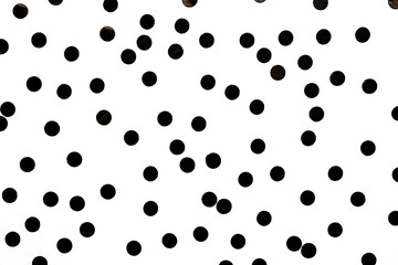 Abstract repeating black circles on a white background. Monochrome.
