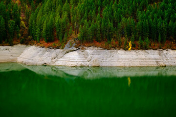 Lakeside Forest Forrest in Mountains by Water Reflections of Autumn Fall Trees