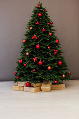 Christmas tree pine with red decor with gifts interior postcard for the new year