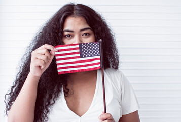 African woman holding american flag