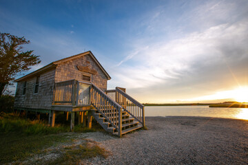 Side view of small wooden naturalist shack on the shore of Assateague Island, Maryland