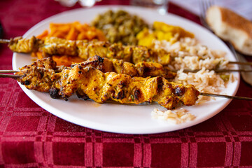 Plate of barbecued lamb skewer