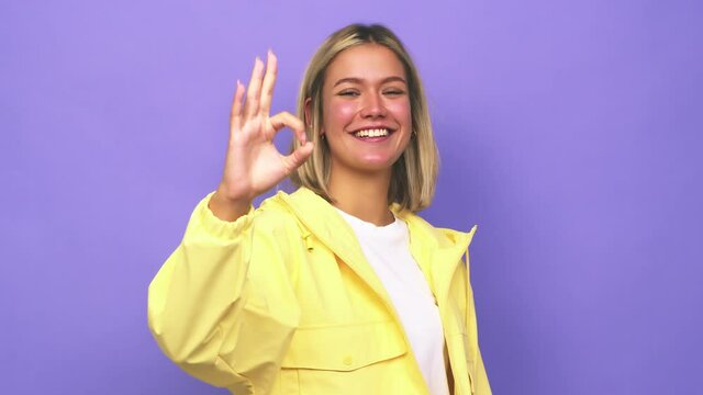 Young blonde caucasian woman cheerful and confident showing ok gesture