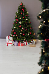 Christmas tree pine with gifts new year decor interior of the holiday postcard