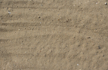 The texture of the sand on the beach at the seaside