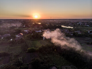 flight over the evening village in summer