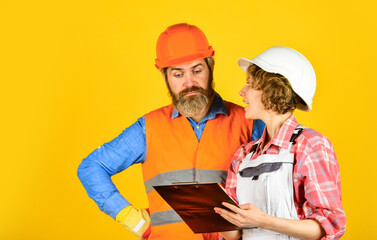 engineers couple working together on building blueprint. work at construction site or factory. Civil engineering. industrial business partner. job and occupation. confident electrical and technician