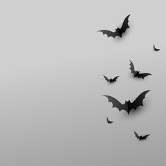 Minimal creative background with paper scary black bats on gray background with copy space