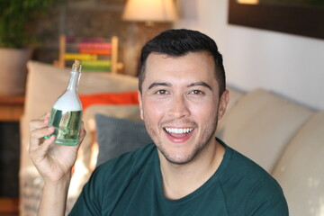 Young ethnic man showing secret potion