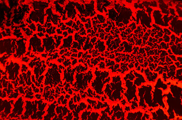 Naklejka na ściany i meble Texture of red glowing lava.
