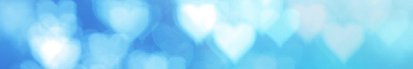 Fototapeta premium Defocused blurred heart shaped lights. Valentines Day background.