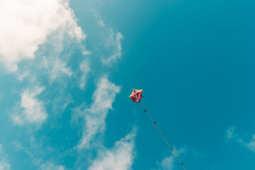 Naklejka na ściany i meble colorful kite flying up in the sky