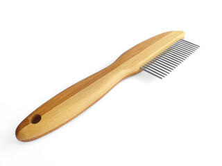 Wooden pet bristle brush isolated on white background. Care of the coat of dogs, cats with a brush of fine metal bristles and joints. Accessory for the grooming of the dog.
