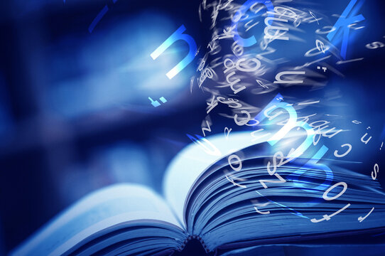 Open book on the table and english alphabet floating above the book in the library and blurred bookshelf background. education background. back to school concept. - Powered by Adobe