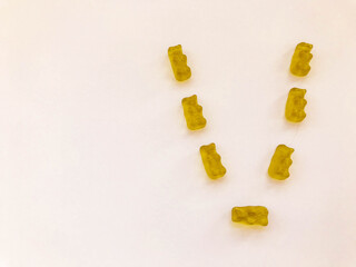 creative edible letter V made from gummy bears. Letter made from yellow gelatinous candies. homemade sweets. cooking masterpiece. sweets, delicious dessert
