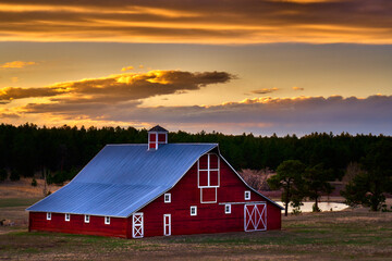 red barn in the sunset