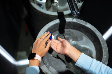 Woman washing hands to protect against the coronavirus